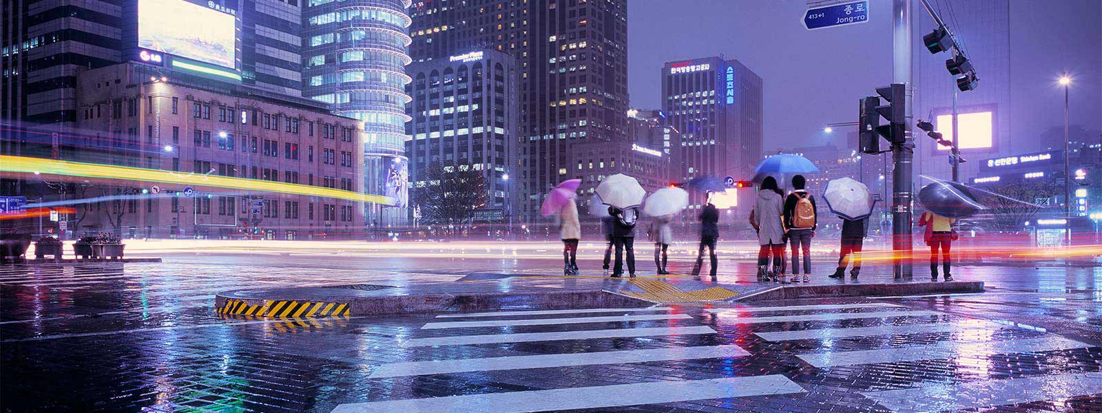 People holding umbrella on a rainy evening