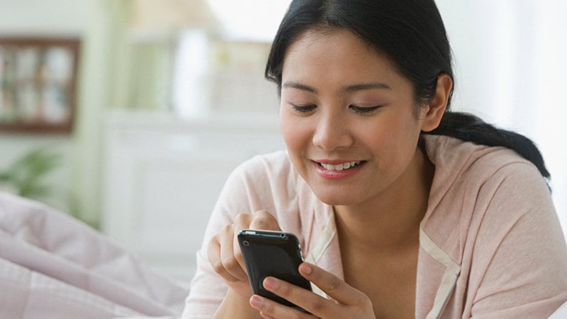 Lady using a phone to do online shopping