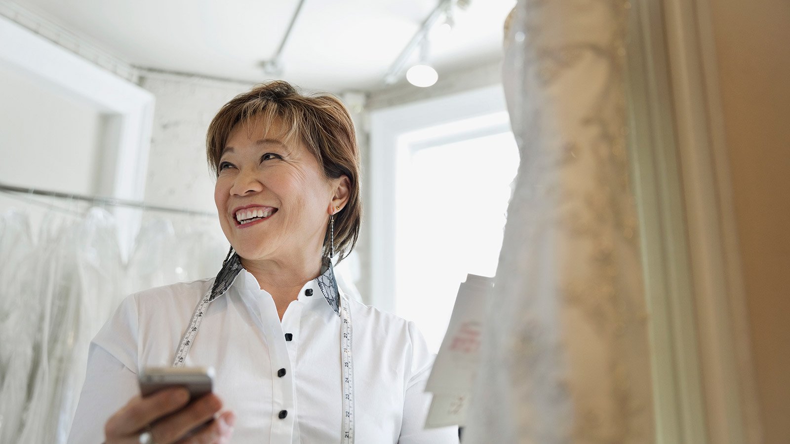 Lady in white browsing for a dress