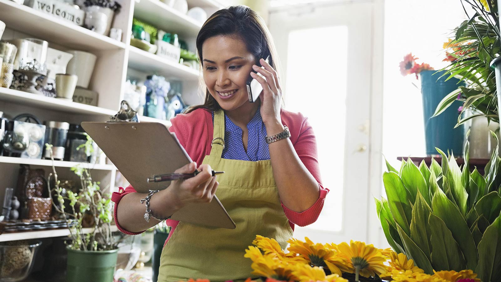 lady-holding-file-on-phone-flowers